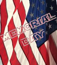 American Flag draped with the words "Memorial Day" over top of it